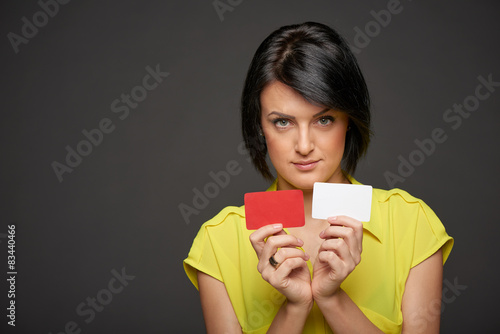 Business woman showing blank credit cards