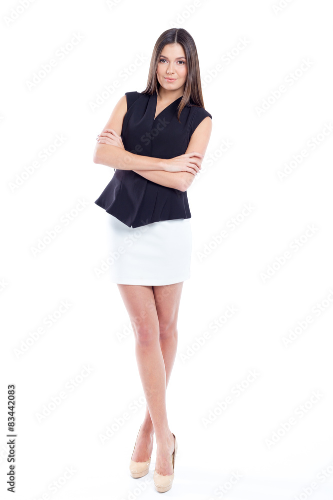 Attractive young woman standing isolated on white Attractive young woman standing isolated on white
