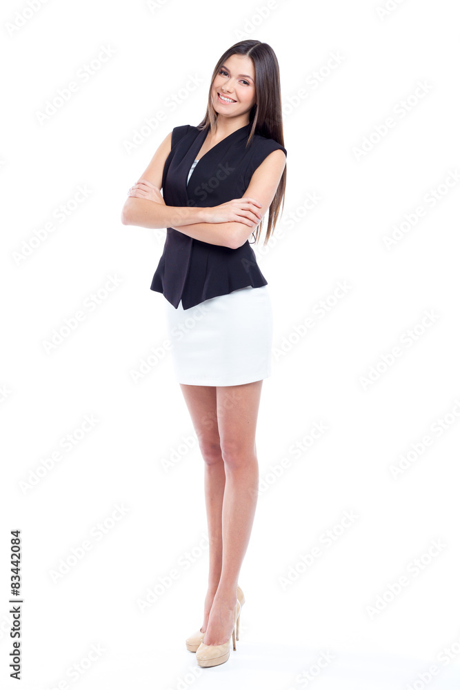 Attractive young woman standing isolated on white Attractive young woman standing isolated on white
