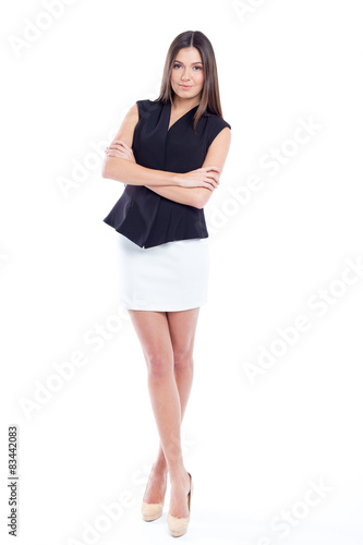 Attractive young woman standing isolated on white © fotofabrika