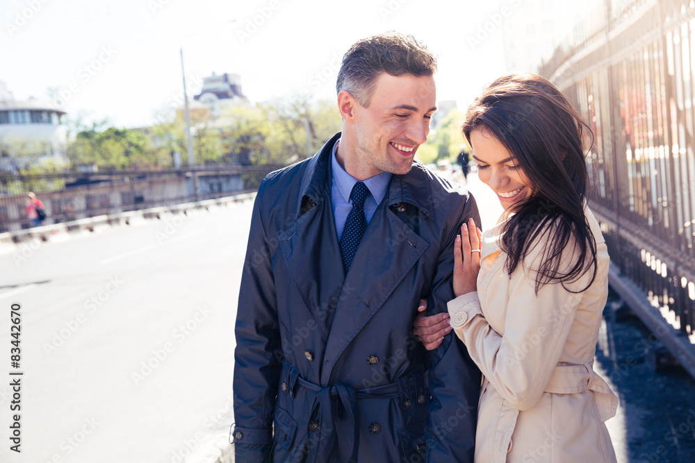 Smiling couple walking outdoors
