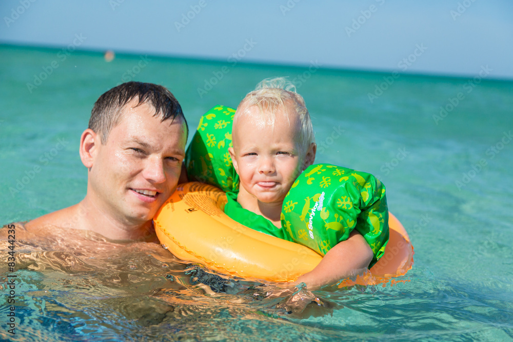 Father teaching his son to swim Father teaching his son to swim