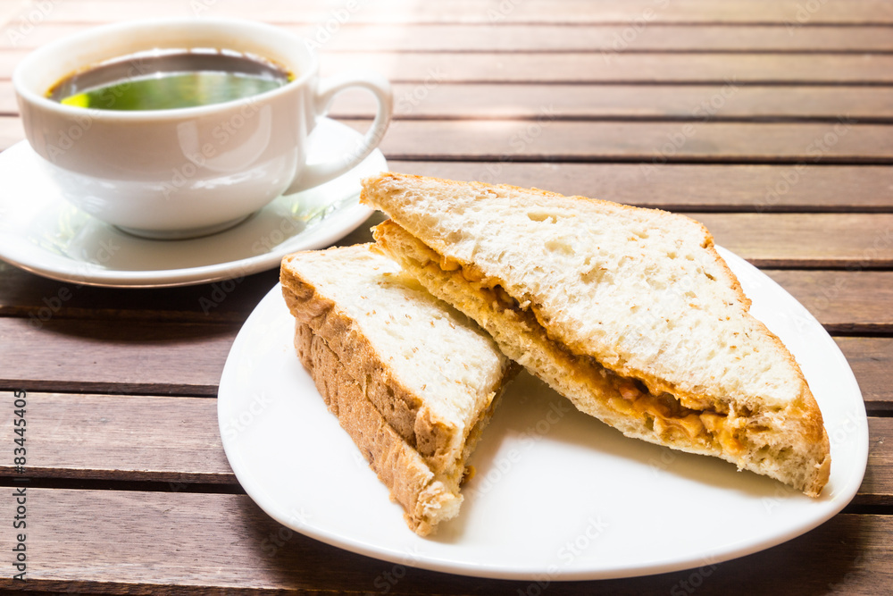 Sandwich bread servedwith black coffee at background Sandwich bread servedwith black coffee at background