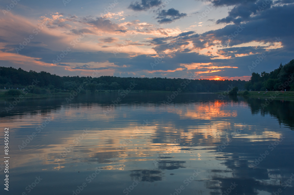 Fototapeta premium Summer evening landscape after sunset on a pond in the forest