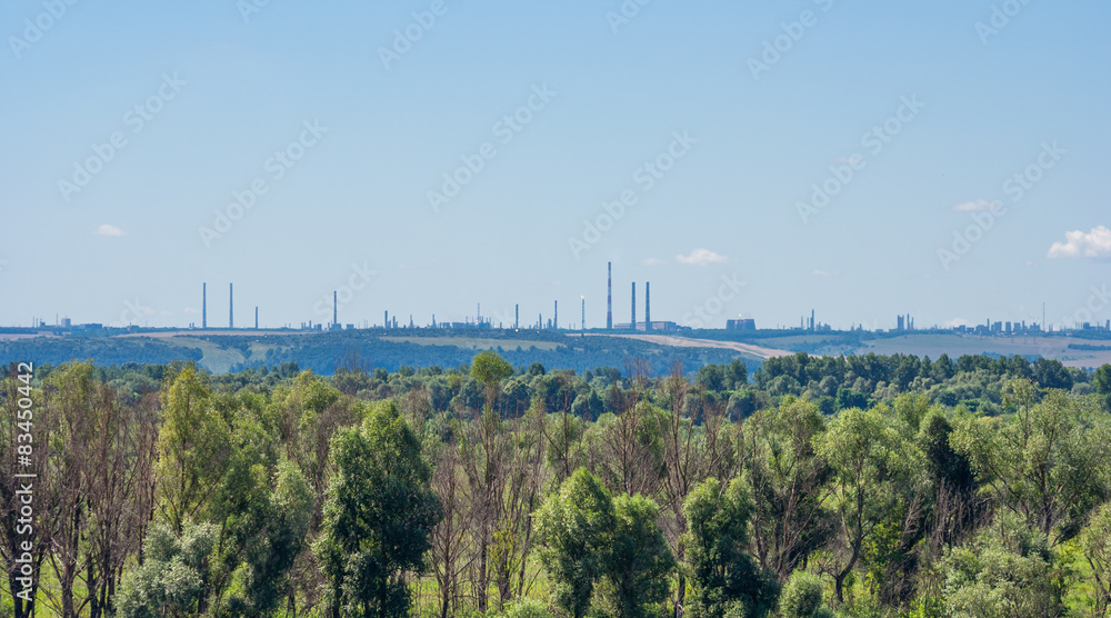 Summer landscape with petrochemical processing plants