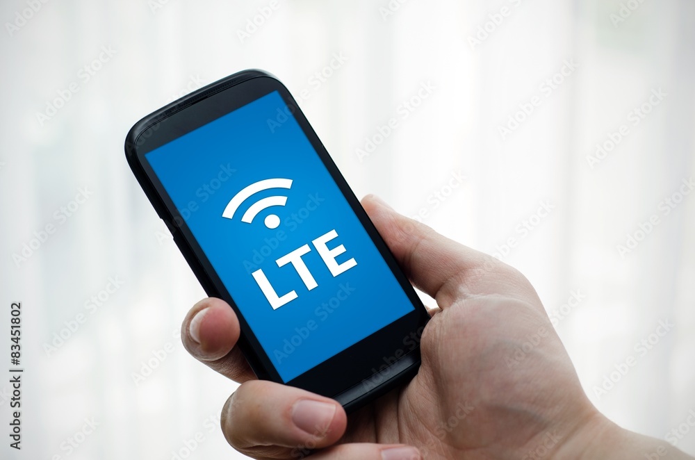 Hand holding mobile phone with LTE fast internet technology Hand holding mobile phone with LTE fast internet technology