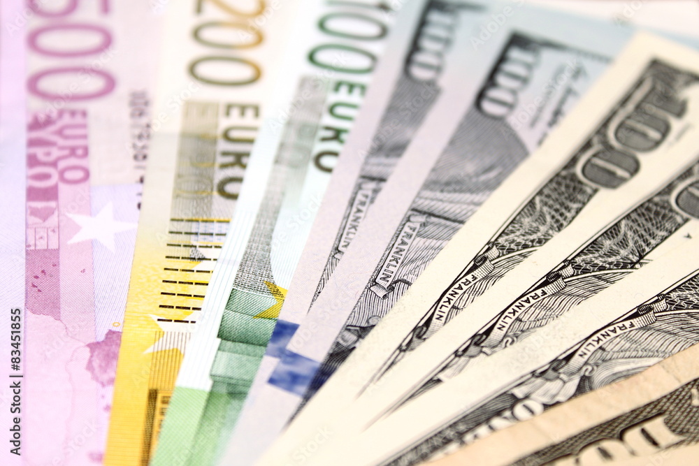 Background of euro and dollar bills. Shallow focus. Background of euro and dollar bills. Shallow focus.
