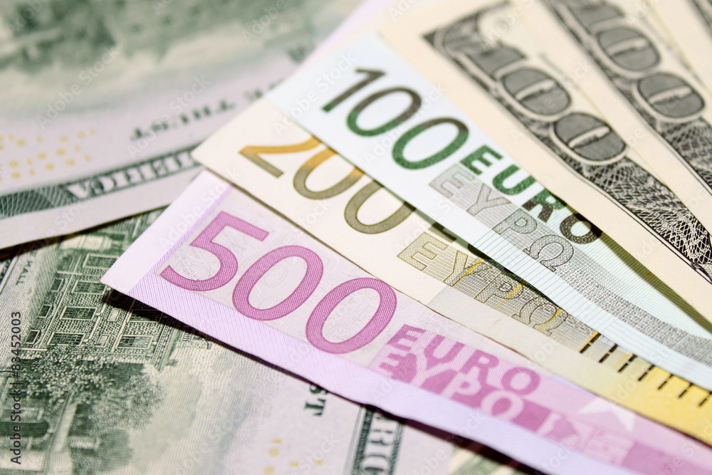 Background of euro and dollar bills. Shallow focus. Background of euro and dollar bills. Shallow focus.