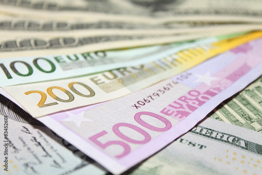Background of euro and dollar bills. Shallow focus. Background of euro and dollar bills. Shallow focus.