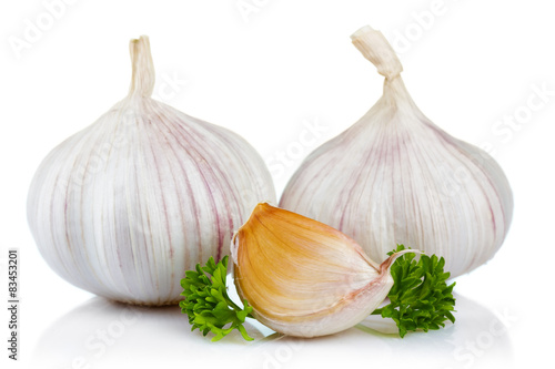 Garlic and parsley leaves isolated on white