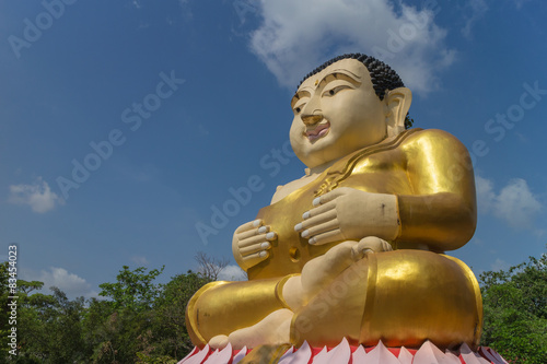 monk statue for katyayana sitting with sky background photo