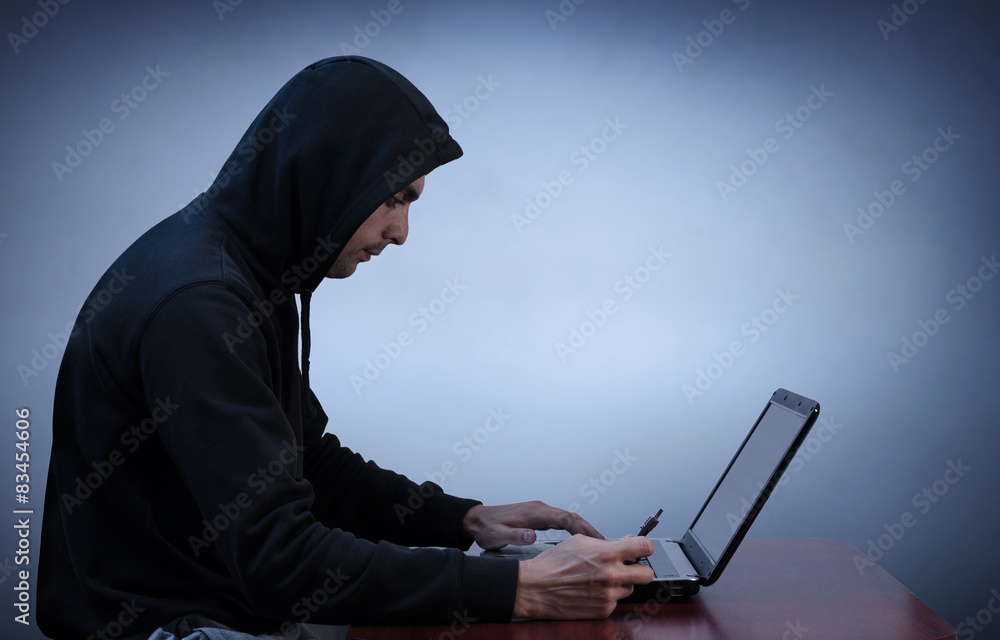 Hacker stealing data from computer Hacker stealing data from computer