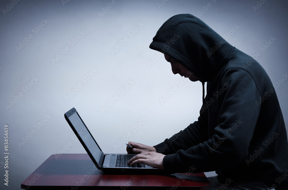 Hacker stealing data from computer Hacker stealing data from computer