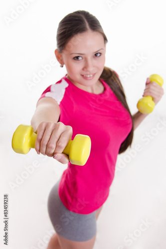 Dumbbells in the hands of athletes