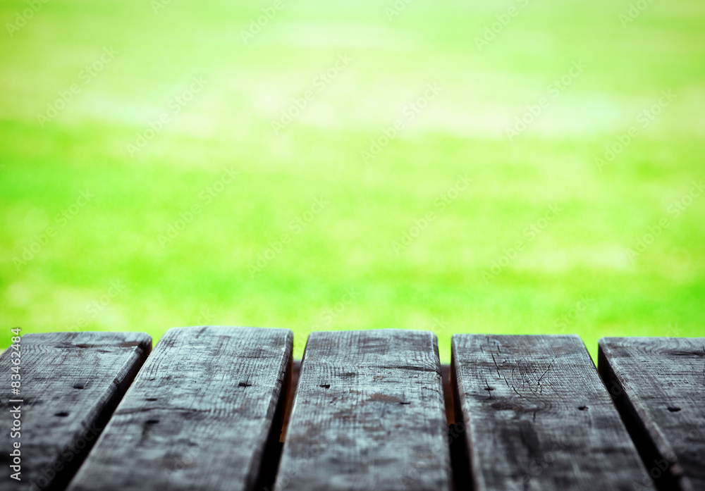 wooden boards of table on natural green background wooden boards of table on natural green background