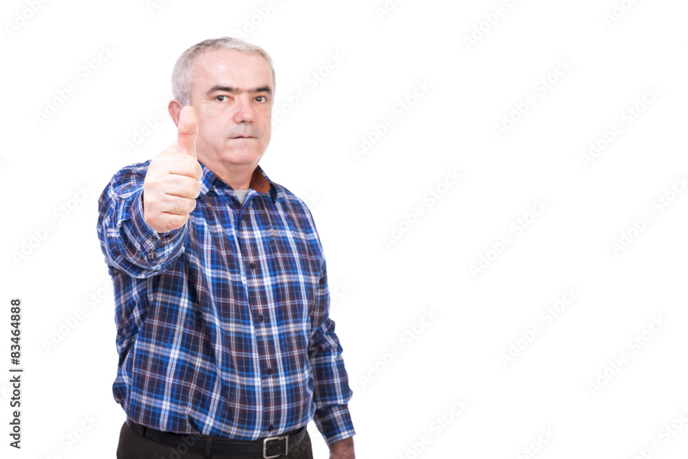 Closeup portrait of elderly man showing thumb up Closeup portrait of elderly man showing thumb up