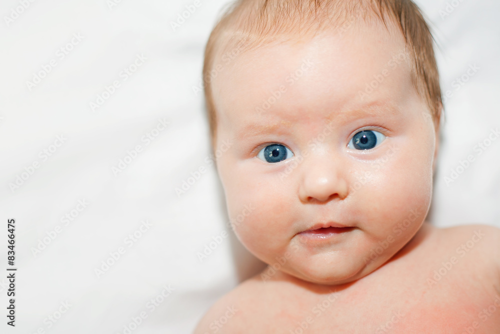 Portrait of newborn girl with blue eyes looking at you Portrait of newborn girl with blue eyes looking at you