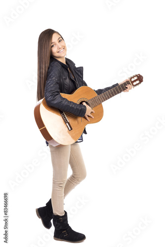 Obraz na płótnie Full length portrait of happy teenage girl playing guitar w salonie