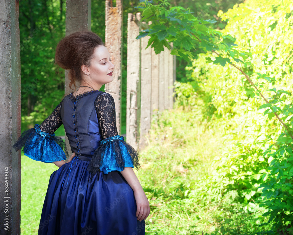 Beautiful young woman in blue medieval dress outdoor Beautiful young woman in blue medieval dress outdoor