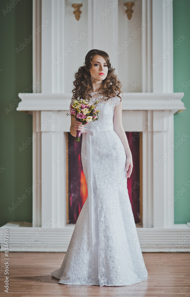 Fototapeta premium The young bride costs with a bunch of flowers 2645.