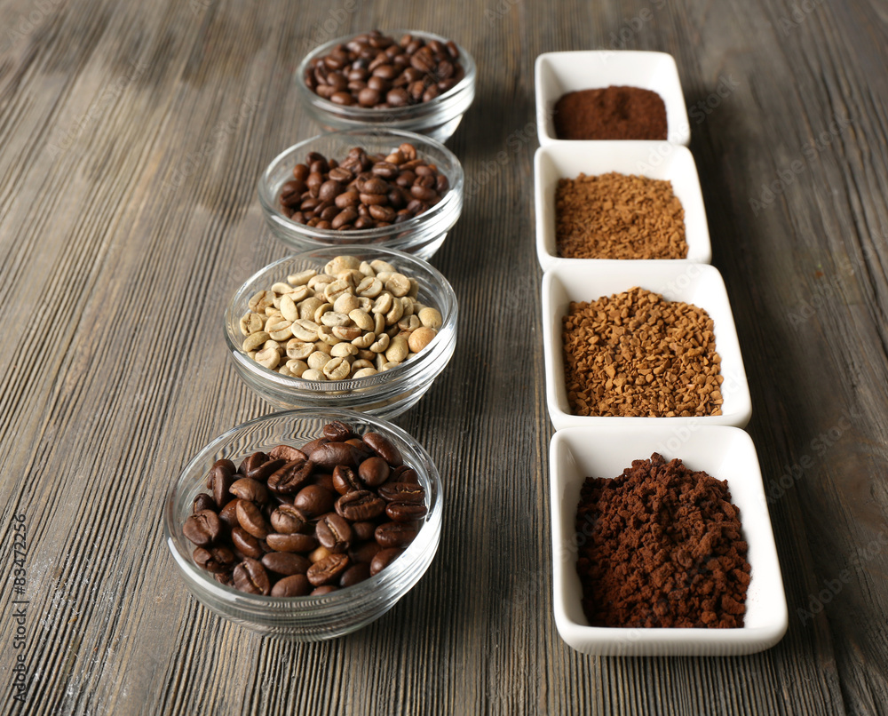 Coffee beans in saucers on wooden background Coffee beans in saucers on wooden background