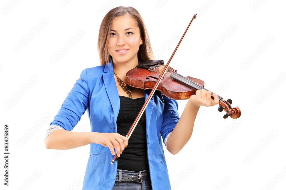 Young female artist playing a violin isolated on white Young female artist playing a violin isolated on white