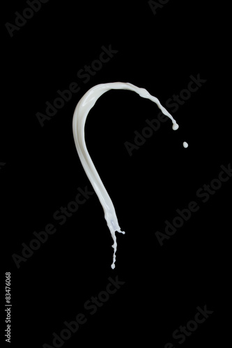 splash of milk on black background