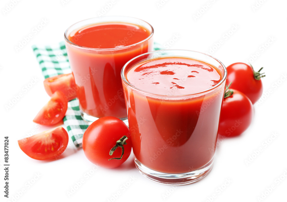 Glasses of fresh tomato juice on checkered napkin, isolated on white Glasses of fresh tomato juice on checkered napkin, isolated on white