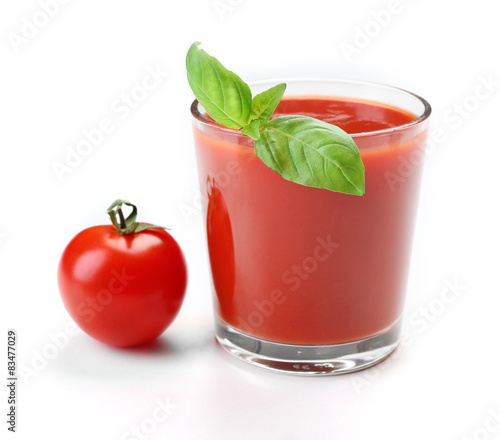 Glass of fresh tomato juice isolated on white