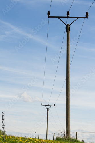 Powerlines against a background of the sky