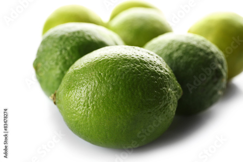 Group of fresh limes isolated on white