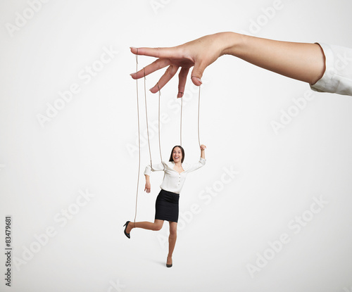 Fotografie, Obraz hand manipulating the small puppet