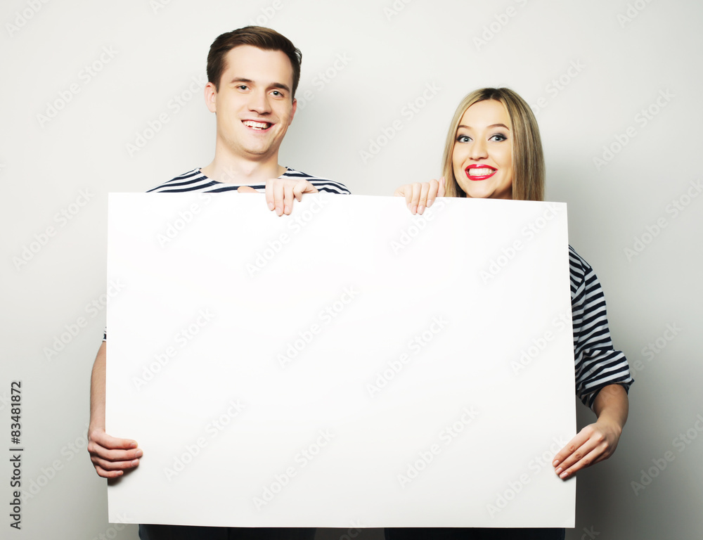 Couple holding a banner Couple holding a banner