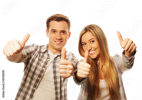 lovely couple with thumbs-up gesture 