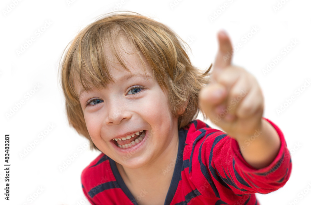 Adorable little boy pointing and smiling isolated on white backg Adorable little boy pointing and smiling isolated on white backg