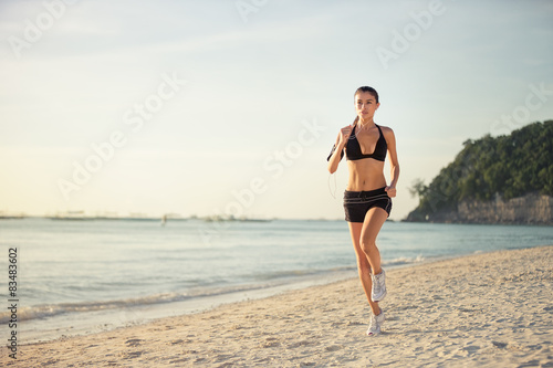 woman running seaside beach