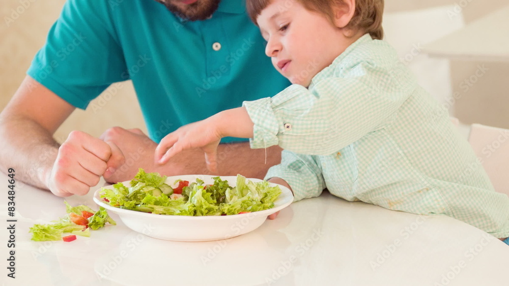 Dad and son cooking together