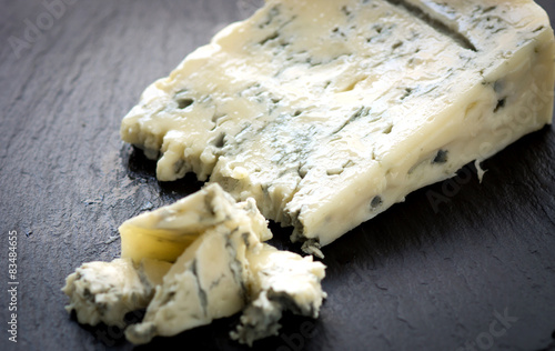 Gorgonzola cheese on black background photo