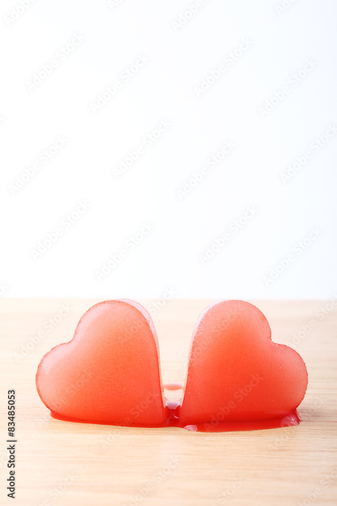 two red heart-shaped ice from raspberry syrup two red heart-shaped ice from raspberry syrup