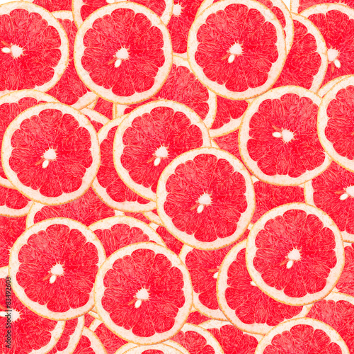 Abstract background with fresh grapefruit. Seamless pattern