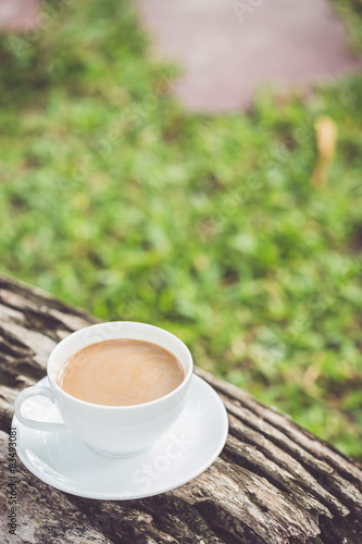 White coffee cup in the garden