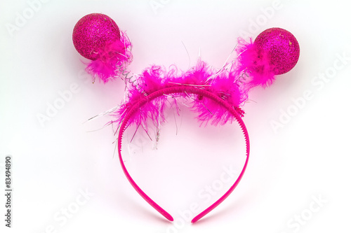 Pink band on the head with ball feather isolated on a white back