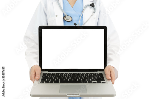 Doctor showing laptop with copy space