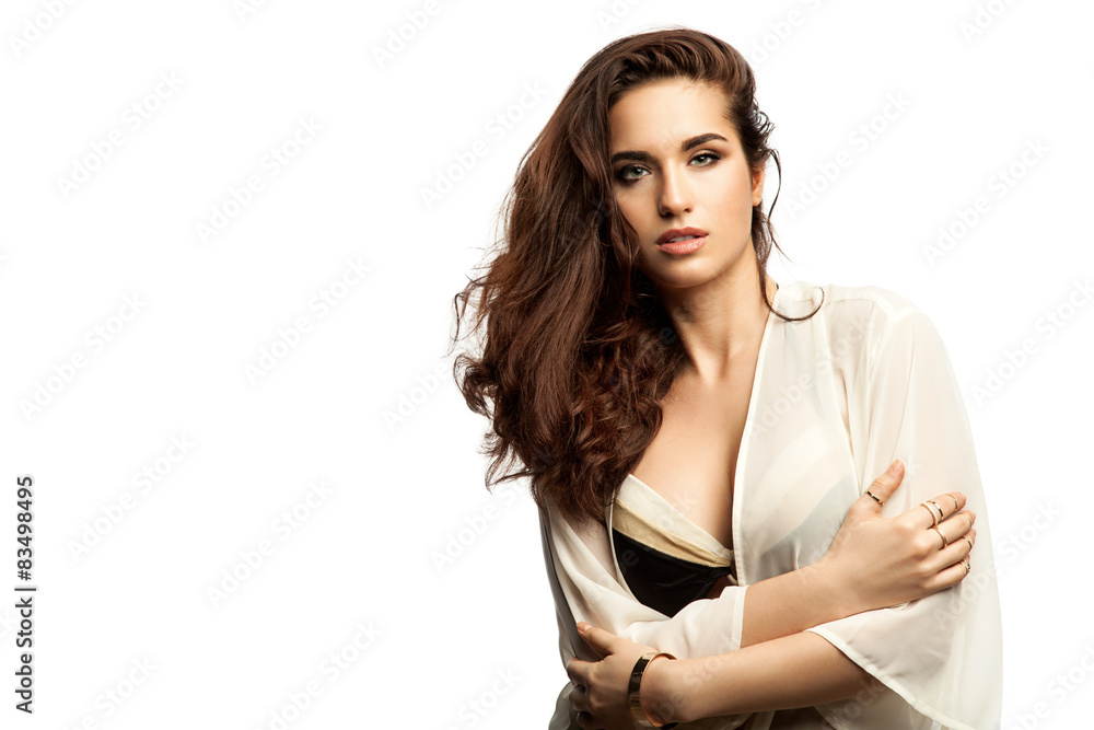 Fototapeta premium Young woman with lush hair in a bikini and tunic 