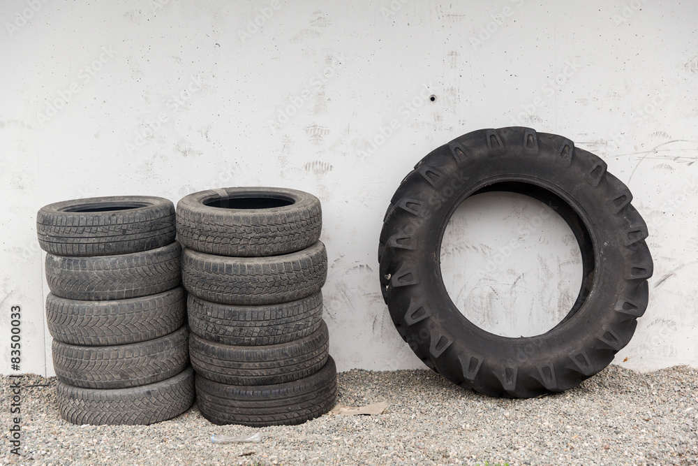 close up of wheel tires stored near wall close up of wheel tires stored near wall