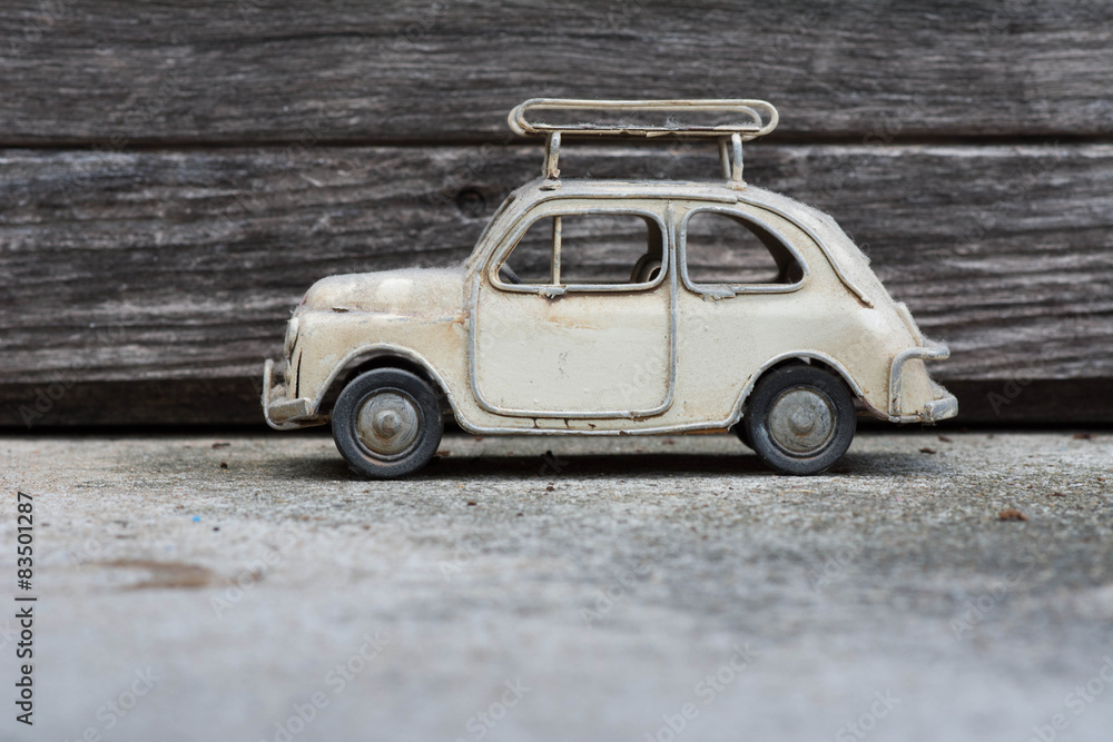 RETRO Classic Car Model with Old Wood Background