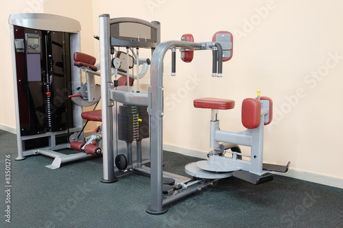 Modern interior of a fitness club gym with sport equipment 