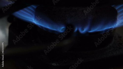 Gas stove blue flame close up photo