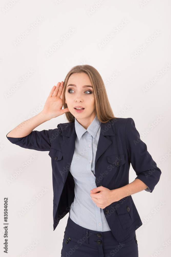 I love gossips! Surprised young businesswoman in suit holding ha I love gossips! Surprised young businesswoman in suit holding ha