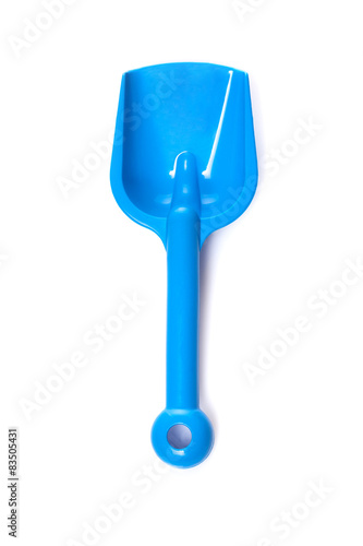 Toy small spade isolated on white background 